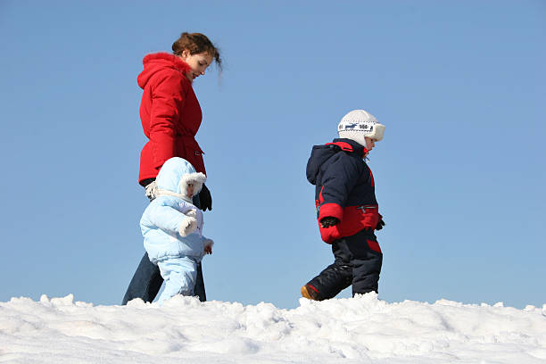 istock mother walk with children. winter. 92081730