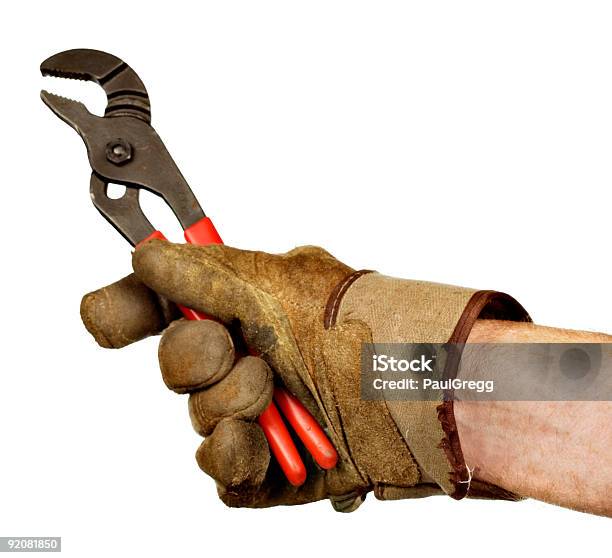 Mano En Guante Sosteniendo Fontaneros Alicates De Bomba De Agua Foto de stock y más banco de imágenes de Color - Tipo de imagen