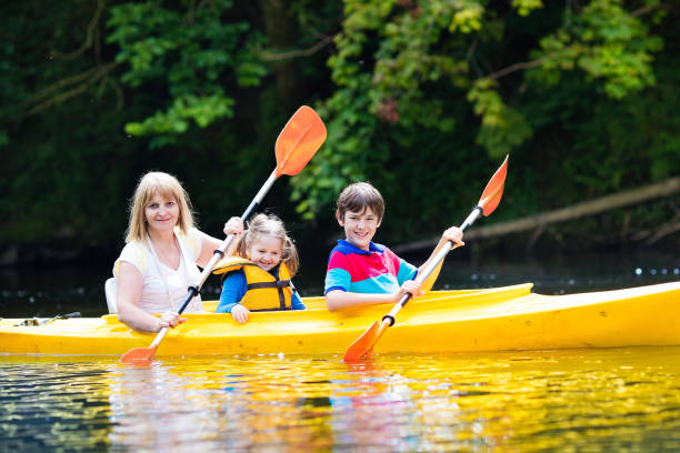 istock Family enjoying kayak ride on a river 920820410