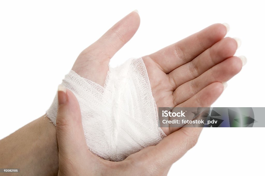 Close up of hand wrapped in bandage The injured hand of the girl tied up by white bandage Assistance Stock Photo