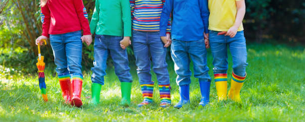 istock Kids in rain boots. Rubber boots for children. 920823880