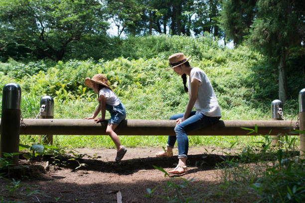 istock Mother and daughter playing in the park 920823910