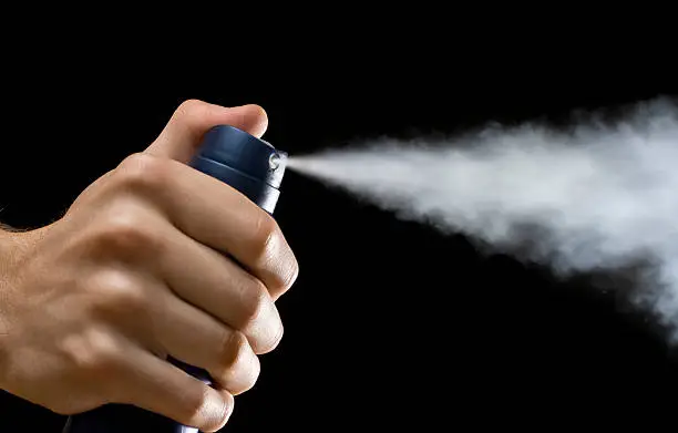 Photo of Spraying deodorant