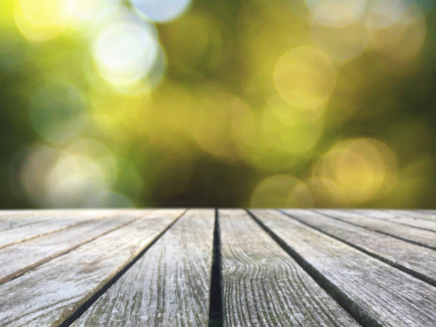 istock Wood Picnic Table Over Blurred Background 920833474