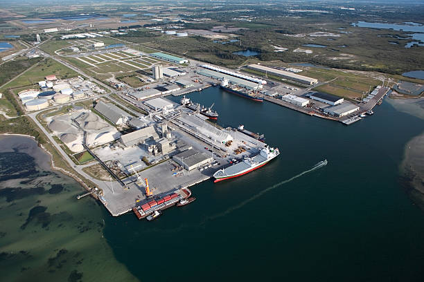 istock Cargo ships docked at sea port Manatee 92083839