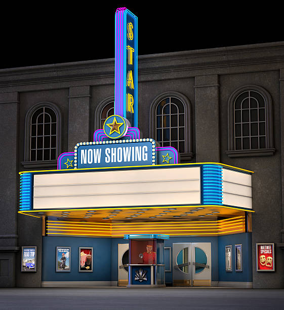 Classic Movie Theatre Exterior night shot of a retro illuminated neon movie theatre box office photos stock pictures, royalty-free photos & images