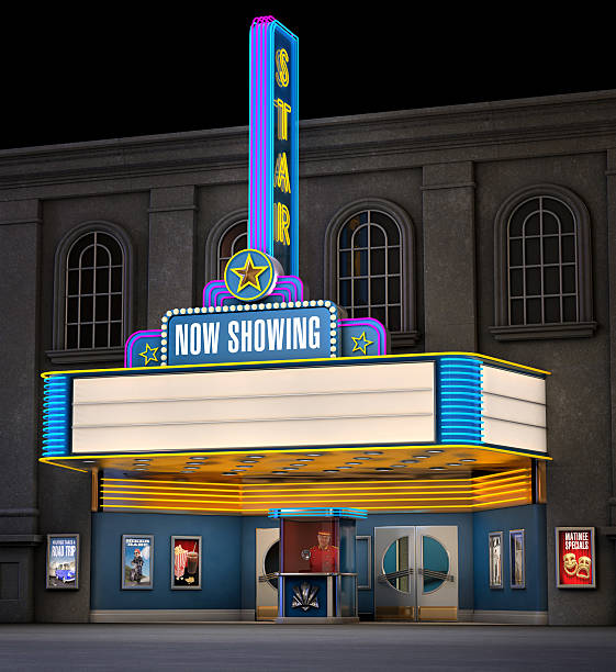 Classic Movie Theatre Exterior night shot of a retro illuminated neon movie theatre theatre building stock pictures, royalty-free photos & images