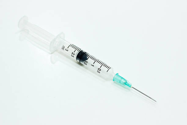 istock 3 ml Plastic Syringe with Needle Isolated on the White Background 920840594