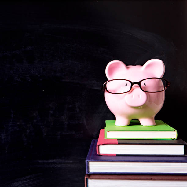 istock Piggy bank glasses blackboard square 920852612