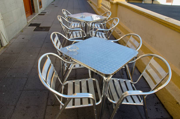 istock Steel table and chairs in street cafe 920862794