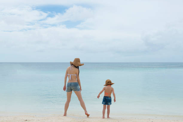 istock Parent and child playing on the beach 920862870