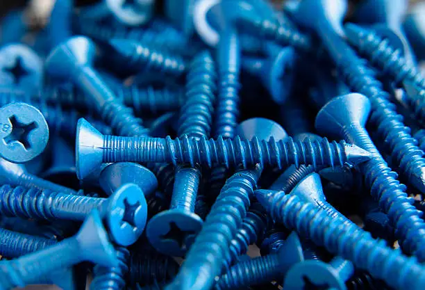 A pile of blue coated concrete screws