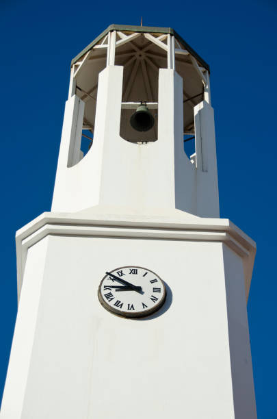 istock Historical city white tower with old bell and clock 920863260