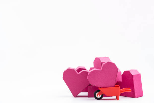 istock Stack of paper box red heart shape on pink background with copy space for your text.Concept Valentine's Day, Day of love. 920865694