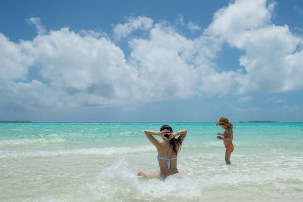 istock Parent and child playing on the beach 920870208