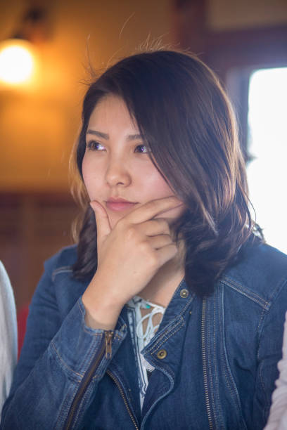 istock Young woman posing in cafe 920870272