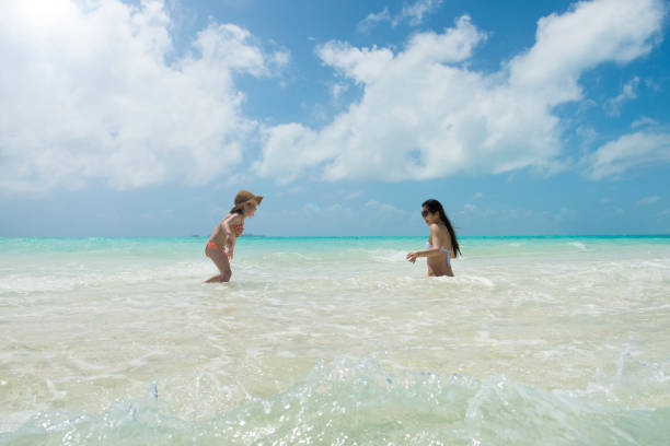 istock Parent and child playing on the beach 920870484