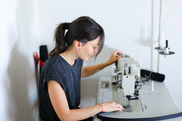 istock craftswoman searching for ideas in internet using smartphone 920870620