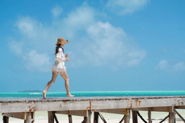 istock A woman playing at a beach resort 920872930