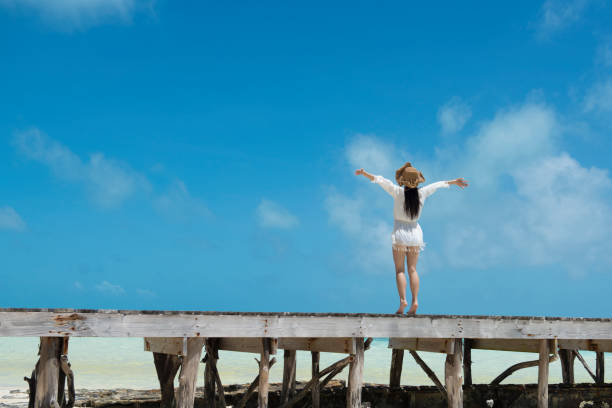 istock A woman playing at a beach resort 920873114