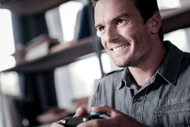 istock Motivated man playing video games 920882522