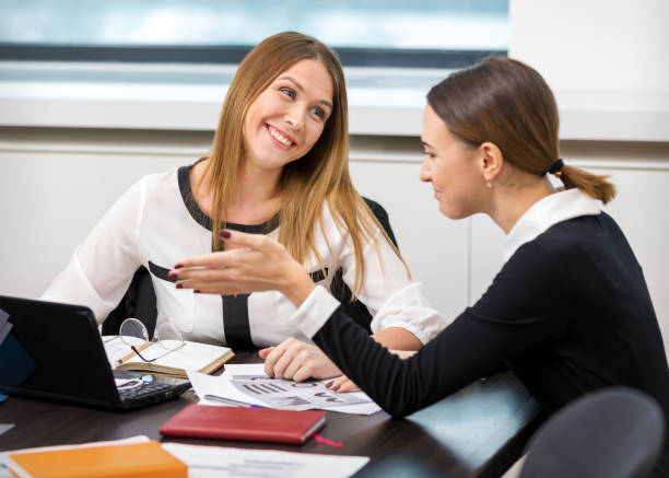 istock girl friends communicate in the office 920882834