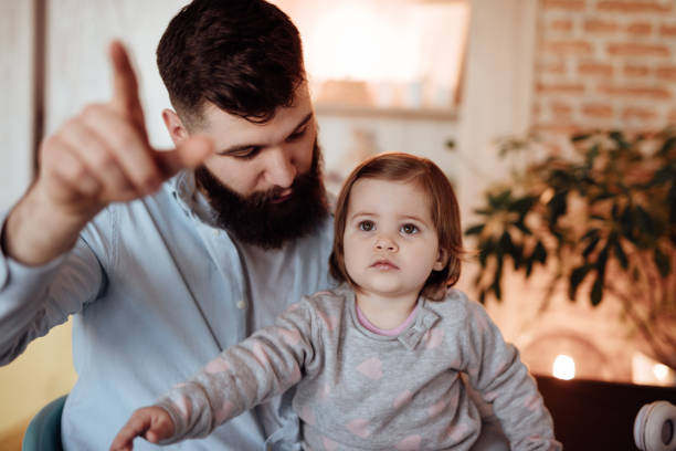 istock Dad showing something to his little girl 920908250