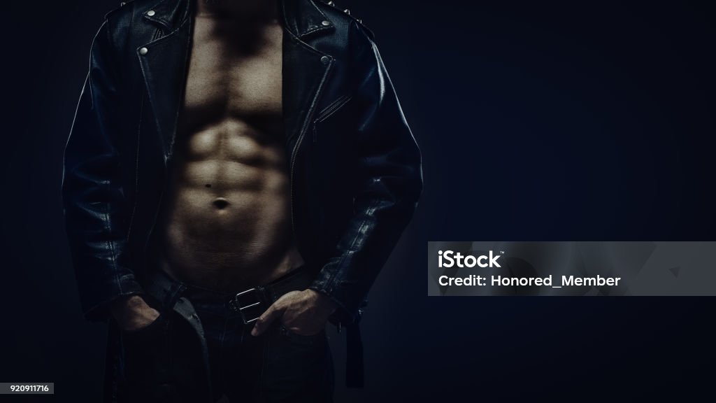 Torso of athletic man in leather jacket Muscular torso of athletic man in leather jacket Males Stock Photo