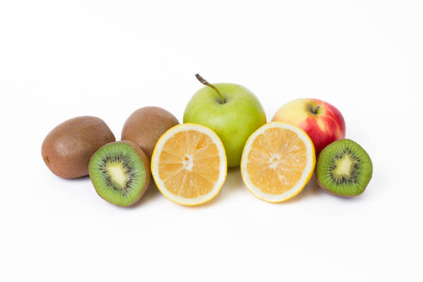istock Fruits in a composition on a white background. Lemon with apples and kiwi on white background. Fruits with carrots on a white background. 920924090