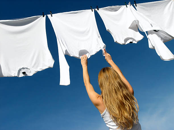 istock Girl, blue sky and white laundry 2 92093024