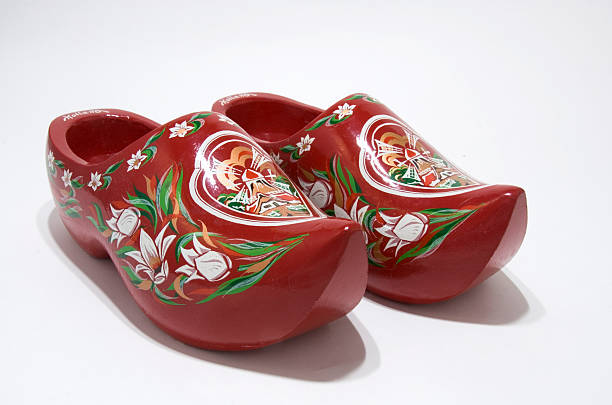 Traditional wooden clogs displayed on a fence at Dreiländereck, symbolizing Dutch culture in a tri-nation park.