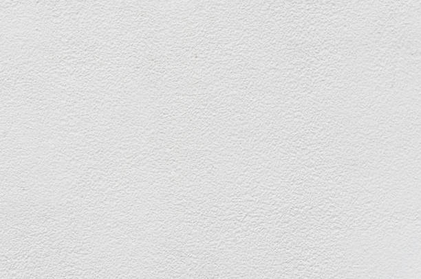 istock white cement or concrete  wall ,rock plastered stucco  textured background 920931376