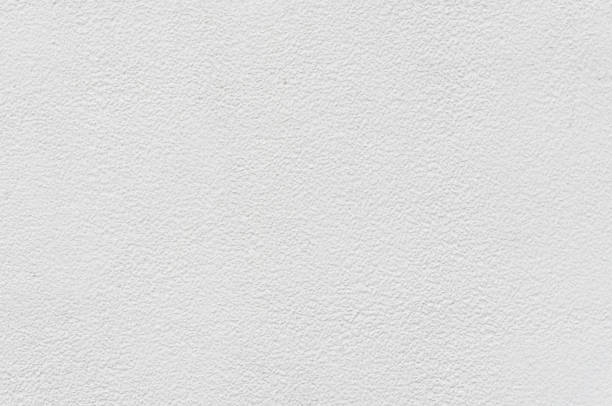белый цемент или бетонная стена, рок оштукатурены штукатурка текстурированный фон - old obsolete house black and white стоковые фото и изображения