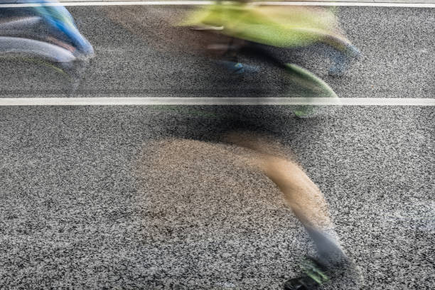 istock People running in marathon on city streets. Motion blur. 920931922