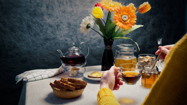 istock Woman having breakfast with toasts and honey 920931962