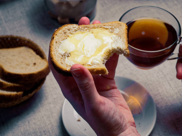 istock Woman having breakfast with toasts and honey 920932008
