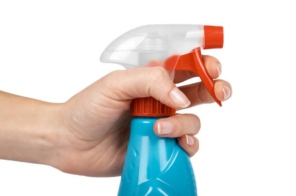 istock Plastic spray pistol cleaner bottle in hand. Isolated on white background 920932262