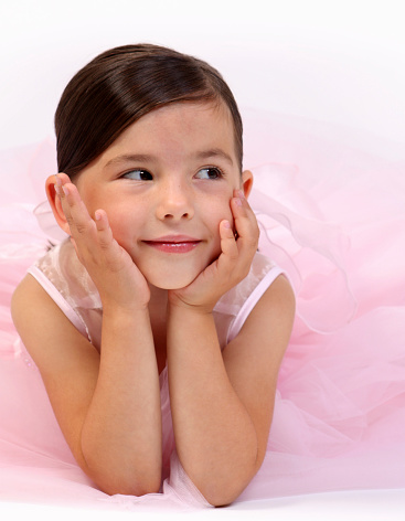 Future contemp dancers. Group of children, little girls in sportive casual style clothes dancing in choreography class isolated on green background in neon light. Concept of music, fashion, art