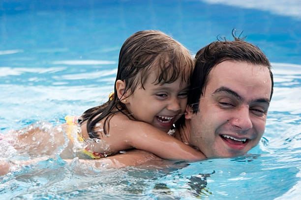 istock Father and daughter in the swimming pool 92093397