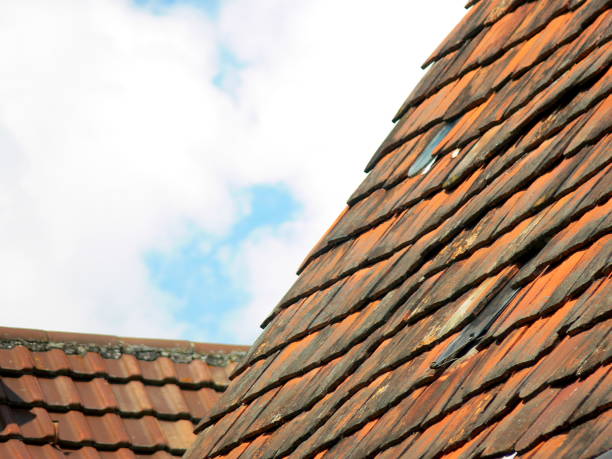 istock Red roof tiles with blue sky 920938054