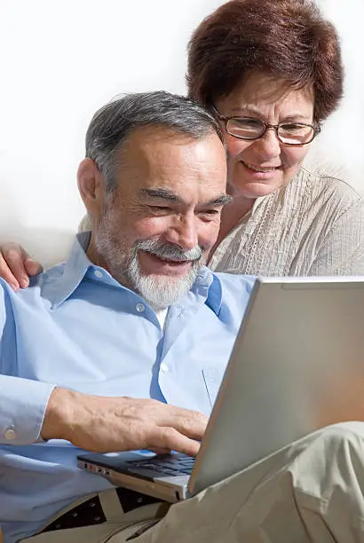 Photo of Senior couple on laptop