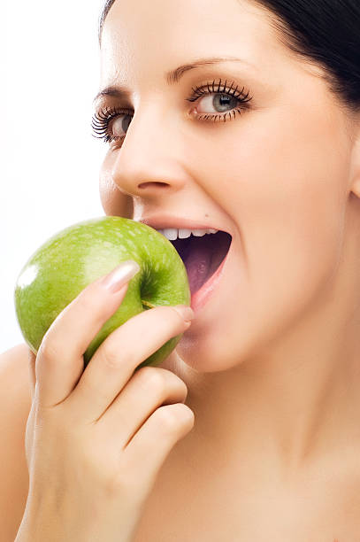 istock Young woman eating apple 92094962