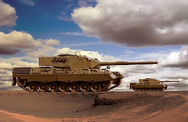 Desert Tanks European-built main battle tanks preparing to engage the enemy in a desert. armored tank stock pictures, royalty-free photos & images