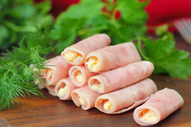 Delicious rolls made of ham stuffed with cheese, garlic and mayonnaise