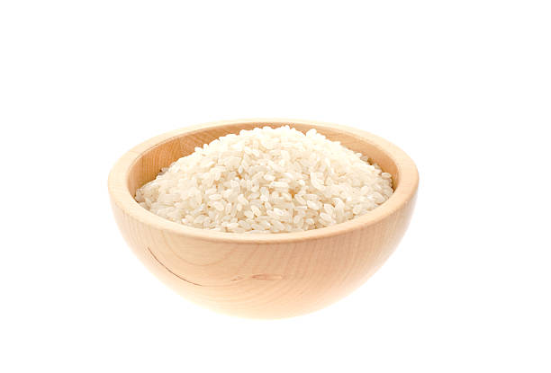 istock rice seeds in a wood bowl 92095618