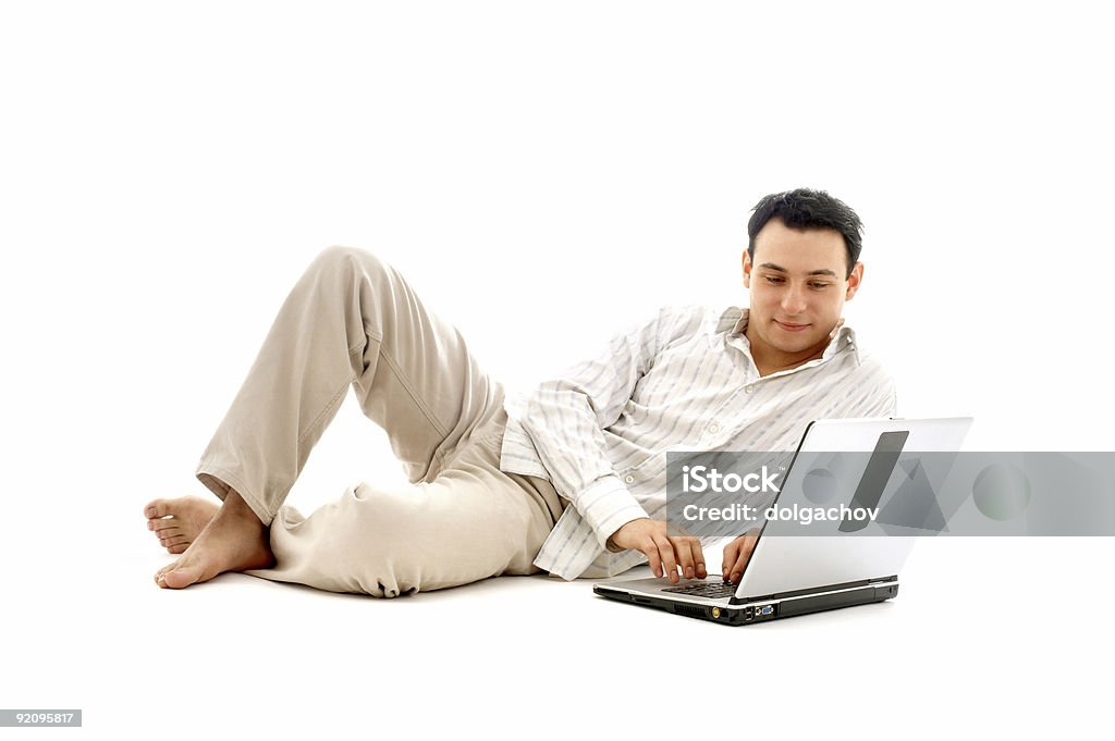 Homme décontracté avec ordinateur portable - Photo de Fond blanc libre de droits