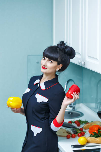 istock Girl chooses vegetables for dinner. 920960166