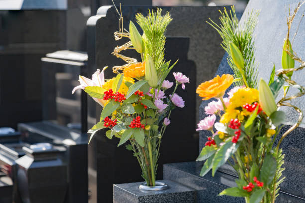 istock Cemetery tombstones and flowers 920960506