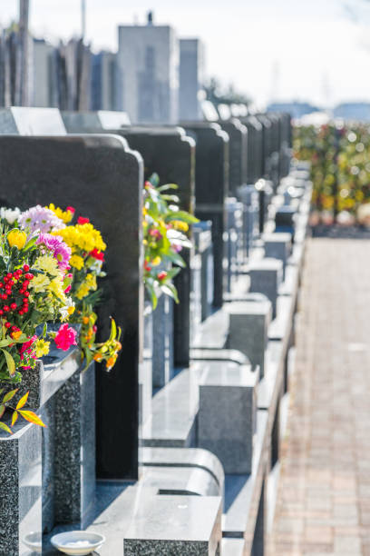 istock Cemetery tombstones and flowers 920960620