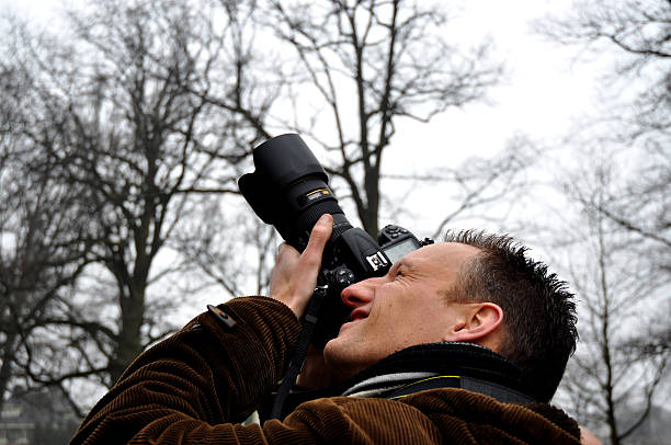 istock Professional photographer focusing on a bird 92096161